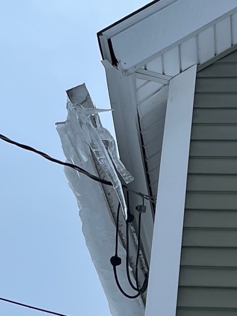 Severe ice dam formation on Vermont roof